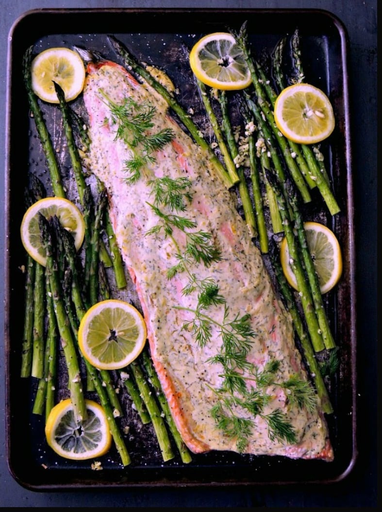 Sheet pan salmon with Dijon dill sauce with asparagus.