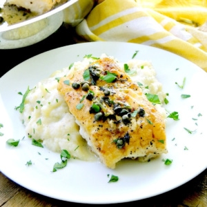 Pan roasted cod with lemon white wine sauce on a bed of mashed cauliflower.