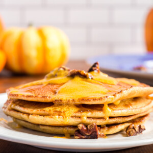 Low carb pumpkin cream cheese pancakes on a white plate.