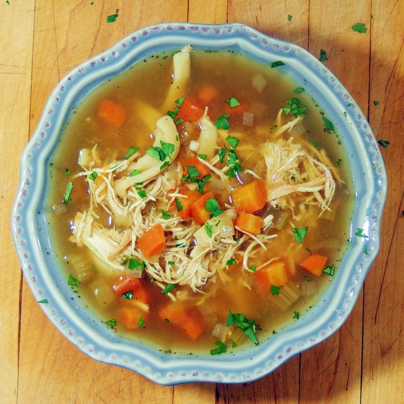 Slow Cooker Chicken Noodle Soup - Break out that slow cooker and make this soup ASAP!! It is, hands down, the best chicken noodle soup ever! From www.bobbiskozykitchen.com