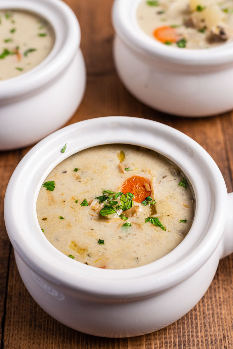 3 white soup ramekins with handles full of Creamy Low Carb Turkey Stew.