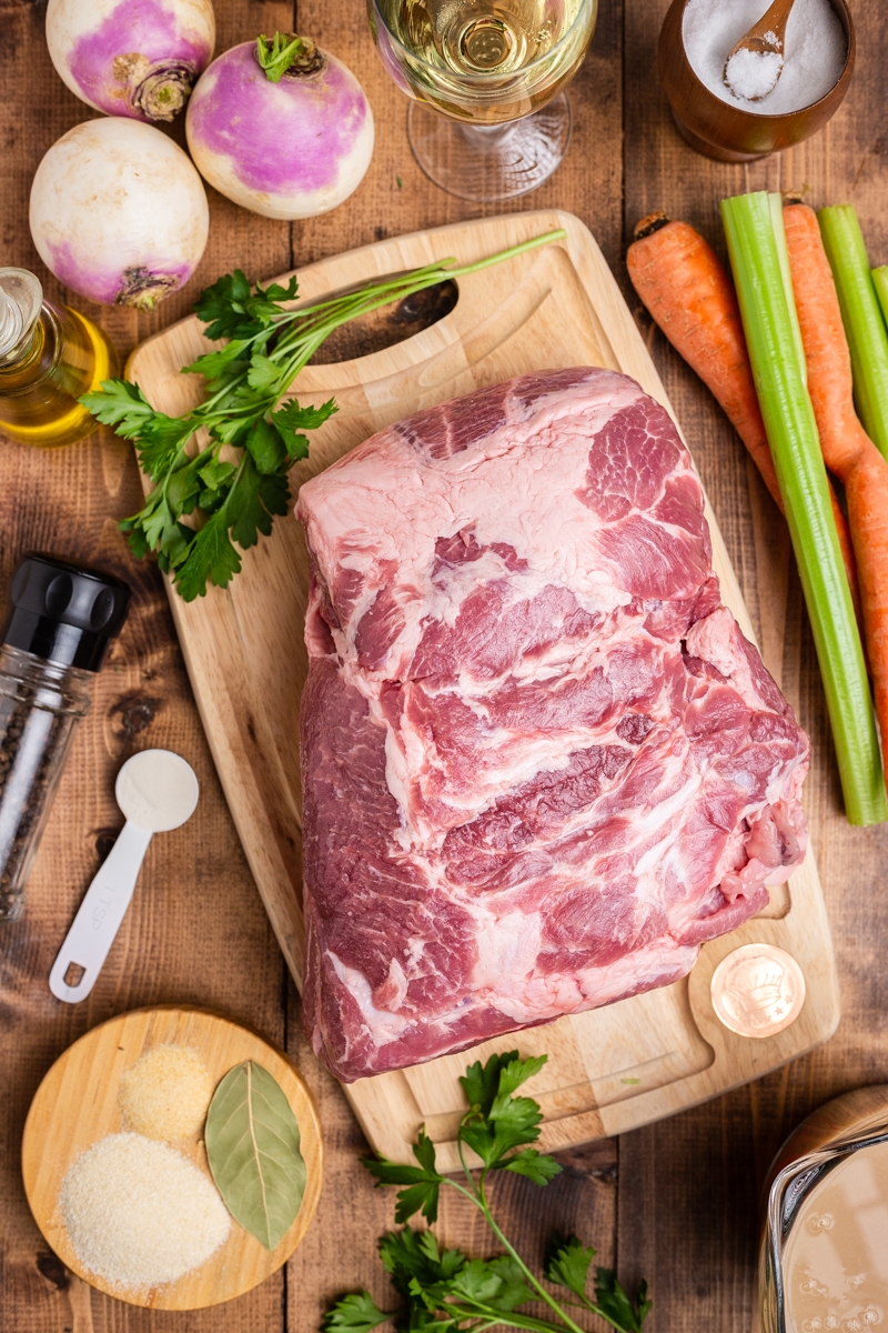 Overhead photo of the ingredients needed to make Low Carb Instant Pot Pork Stew on a wooden table.