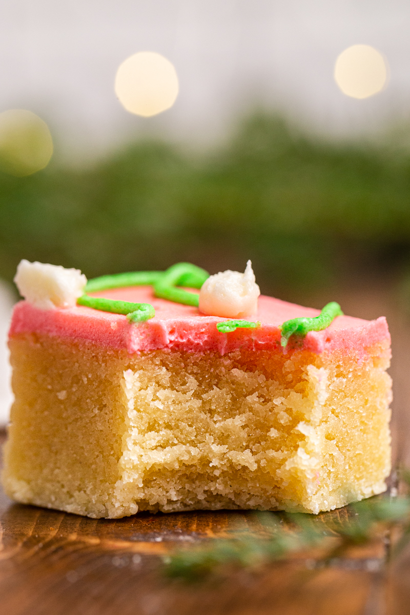 Very close up photo of one Keto Sugar Cookie Bar with a bite taken out of it.