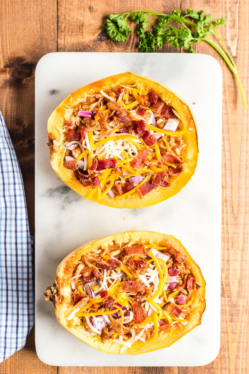 This BBQ Chicken Spaghetti Squash is the perfect low carb way to enjoy your favorite pizza flavors. #lowcarb #keto #glutenfree #spaghettisquash #BBQ #Barbecue #chicken #recipe | bobbiskozykitchen.com