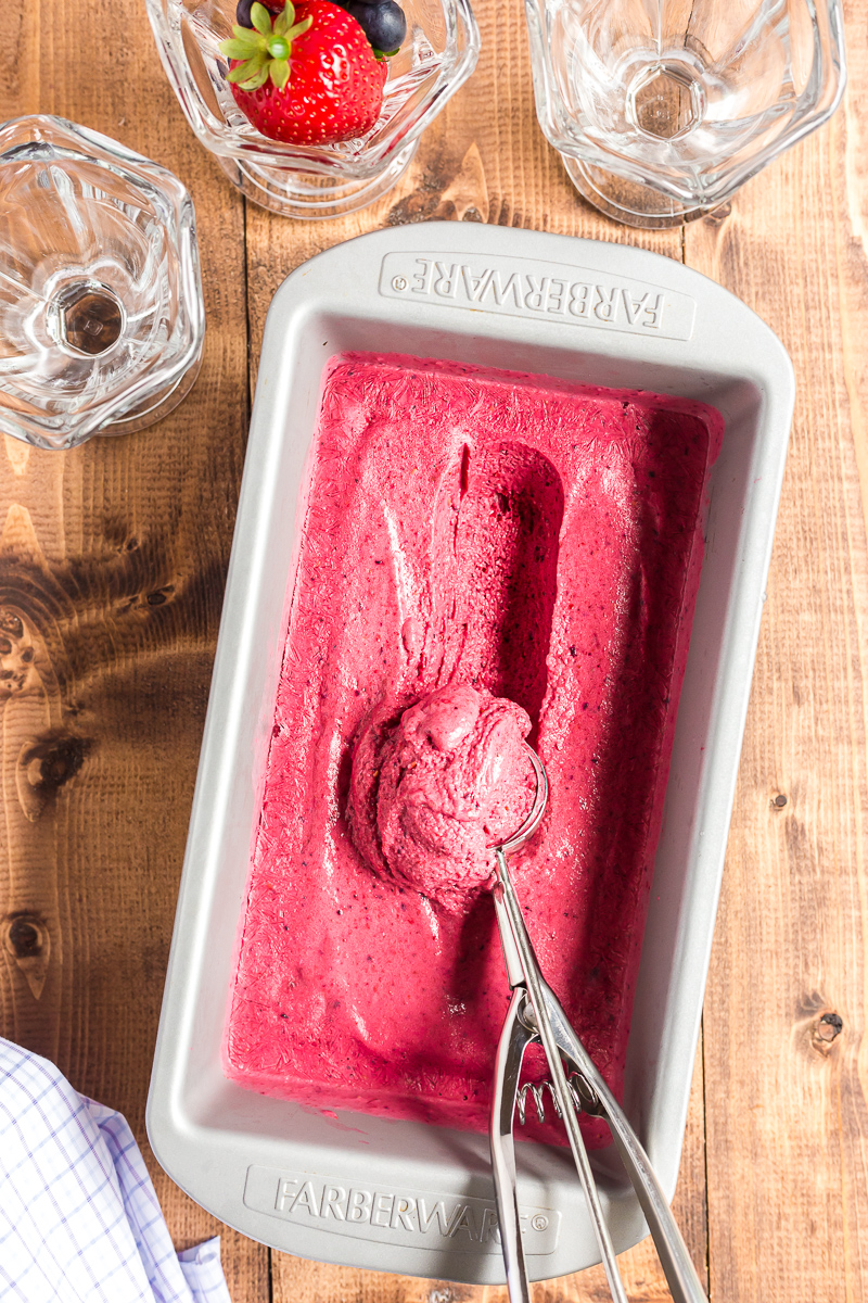 This 4 ingredient, no-churn, sugar-free mixed berry frozen yogurt recipe is keto-friendly, easy to make, and tastes delicious! #keto #lowcarb #sugarfree #nochurn #icecream #frozenyogurt #froyo #berry #dessert #easy #recipe | bobbiskozykitchen.com