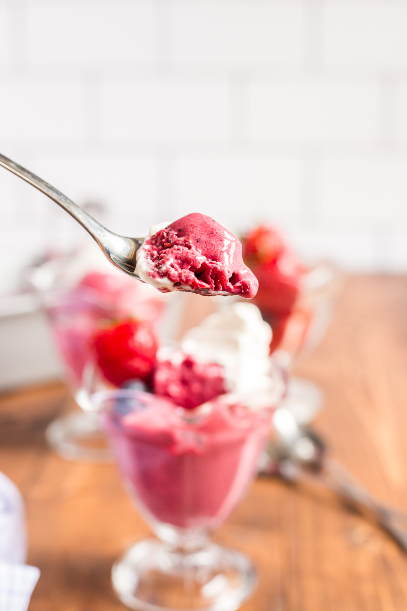This 4 ingredient, no-churn, sugar-free mixed berry frozen yogurt recipe is keto-friendly, easy to make, and tastes delicious! #keto #lowcarb #sugarfree #nochurn #icecream #frozenyogurt #froyo #berry #dessert #easy #recipe | bobbiskozykitchen.com