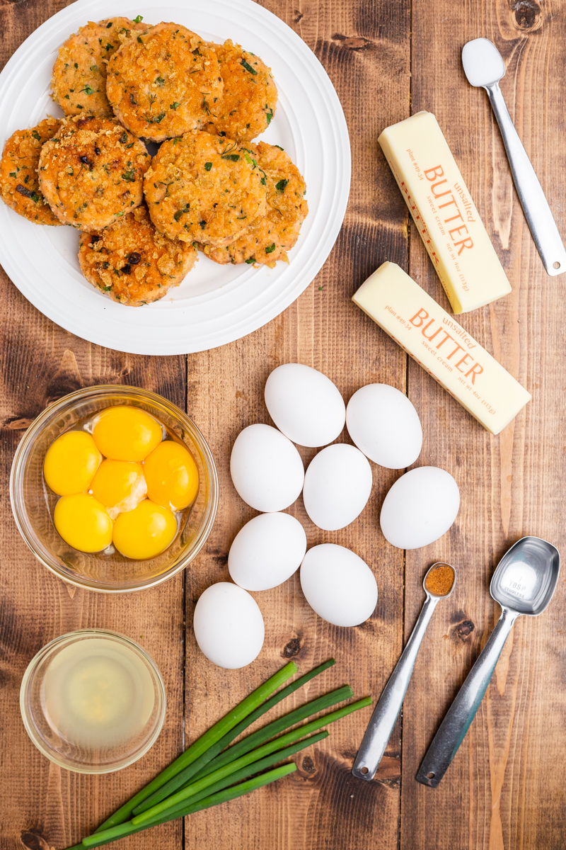 Ingredients needed to make Keto Salmon Eggs Benedict on a wooden table.