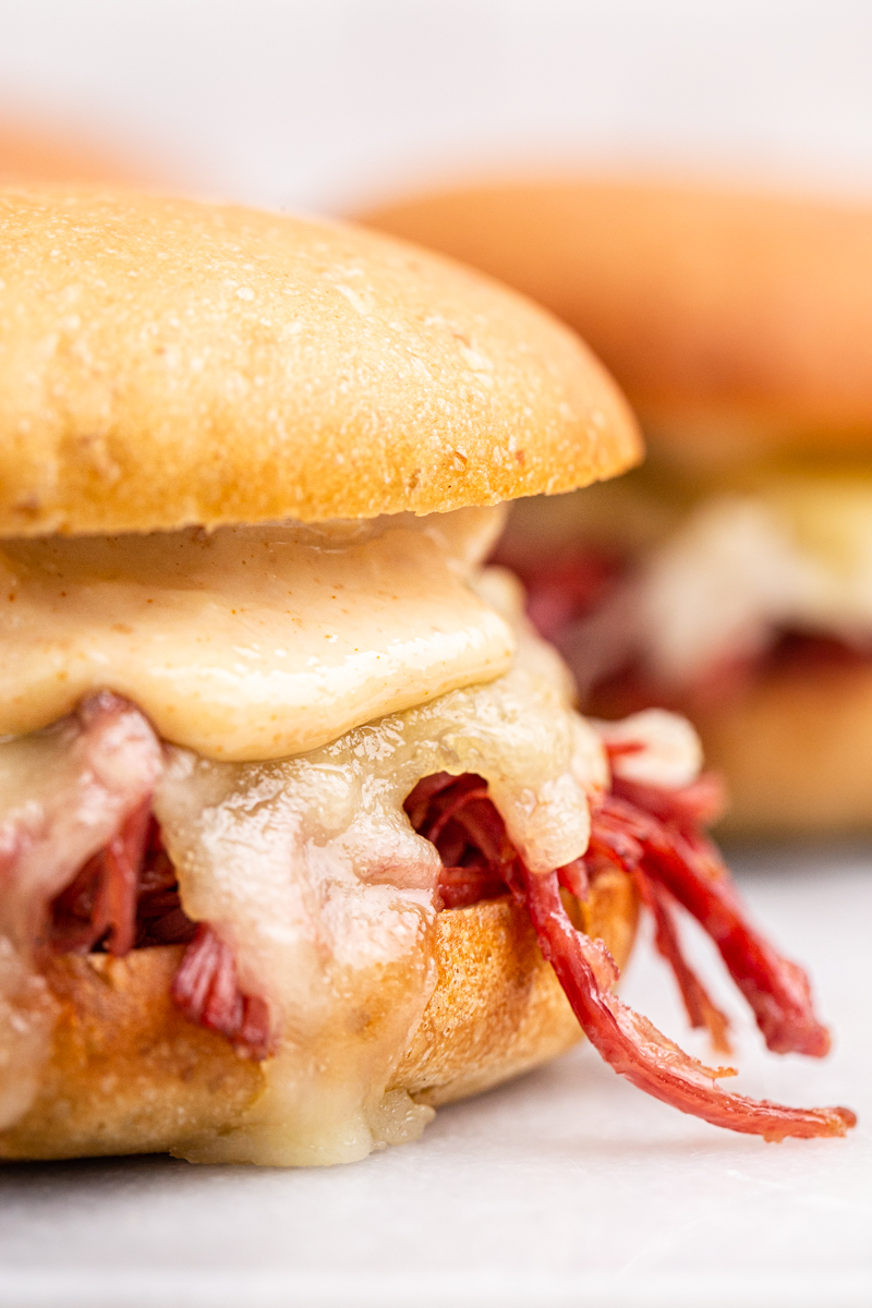 Extreme close of of a Keto Reuben Slider on a white plate.