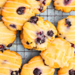 Overhead photo of Keto Blueberry Cheesecake Cookies scattered on a cooling rack.