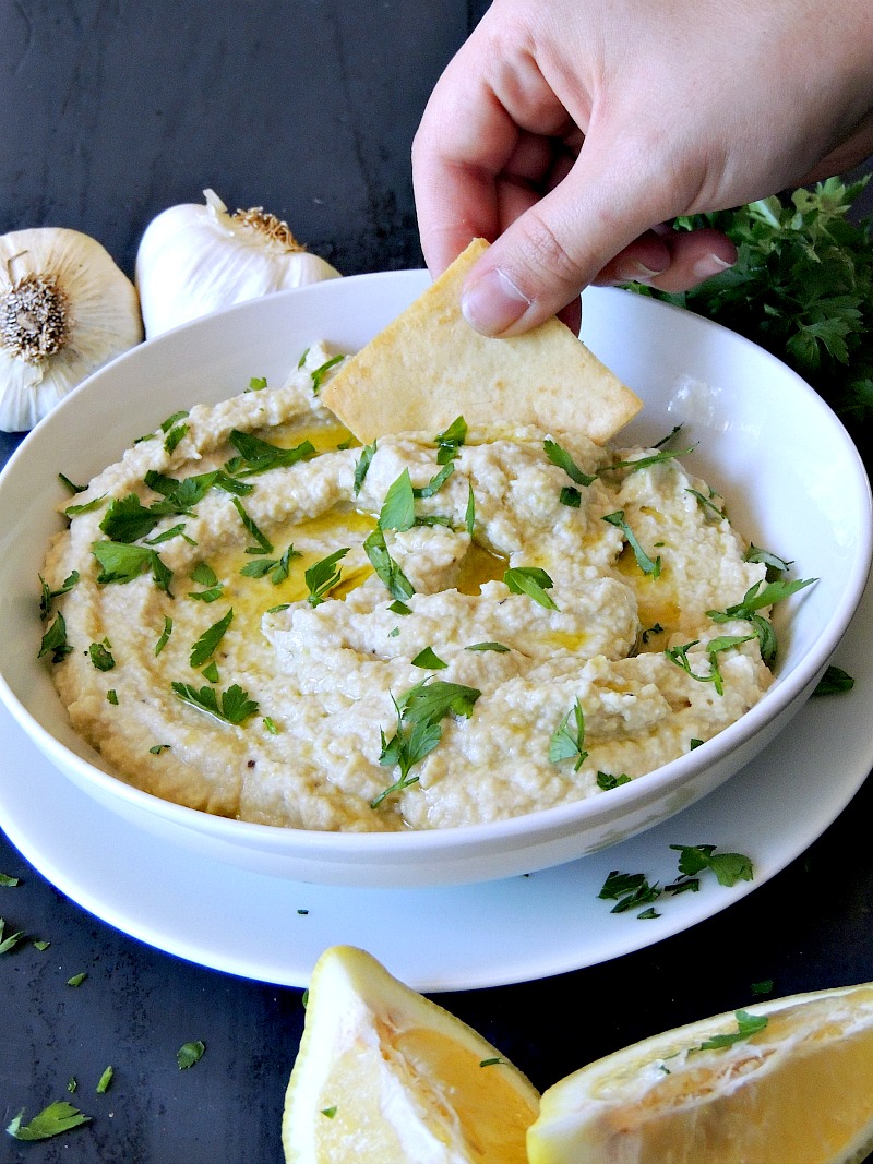 Creamy Artichoke and White Bean Dip - Switch up your normal hummus routine with this delicious artichoke and white bean dip. Eat it with pita chips, fresh veggies, or even on your sandwiches in place of the mayo. From www.bobbiskozykitchen.com