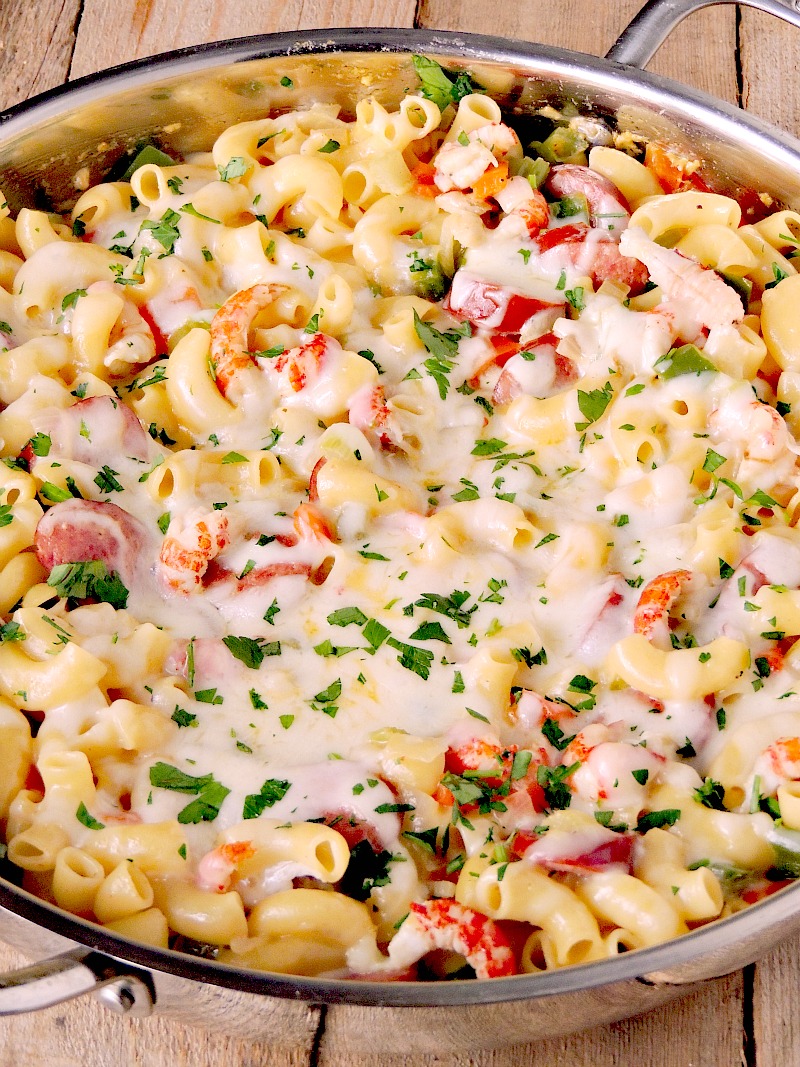 This Jambalaya Pasta with Crawfish and Sausage recipe gives you all of the authentic flavors of your New Orlean's fave, all wrapped in a cheesy pasta dish. #macandcheese #pasta #cheese #cajun #creole #neworleans #mardigras #crawfish #sausage #recipe | bobbiskozykitchen.com