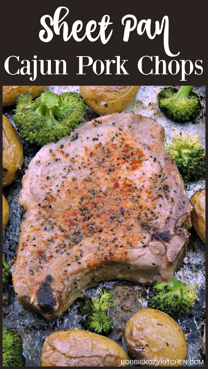 Close up of Sheet Pan Cajun Pork Chops with Potatoes and Broccoli on a metal pan.