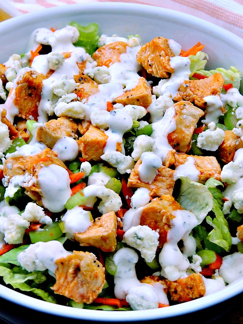 Buffalo Chicken Chopped Salad - Trying to eat lighter doesn't mean you have to forgo your favorite foods. It just takes a little imagination. This Buffalo Chicken Chopped Salad recipe provides all of those Buffalo Chicken Wing flavors you crave minus extra carbs! #salad #buffalochicken #lowcarb #keto #lunch #Healthy #easy #recipe | bobbiskozykitchen.com