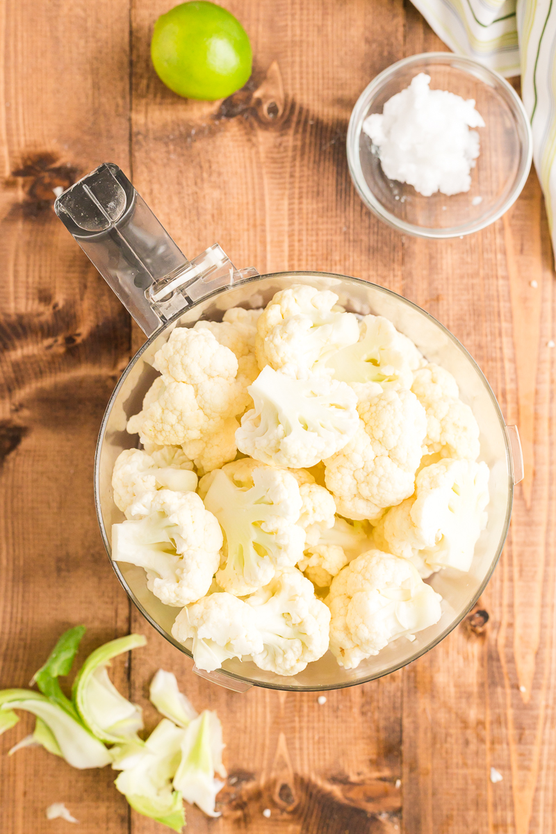 This Coconut Lime Cauliflower Rice recipe takes that ho-hum cauli rice to a new level with coconut milk and fresh lime juice and zest! Perfect for low-carb, Whole30, and gluten-free diets. #whole30 #lowcarb #keto #glutenfree #sidedish #cauliflowerrice #rice #cauliflower #easy #recipe | bobbiskozykitchen.com