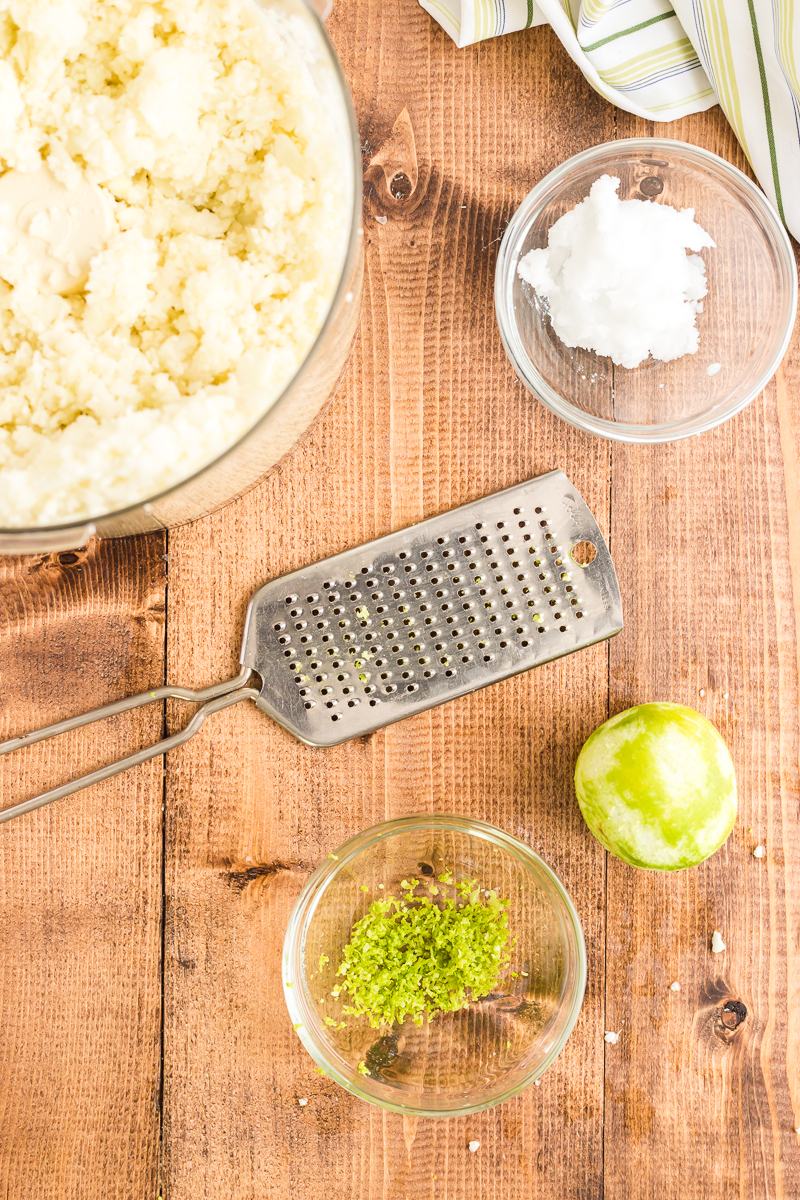 This Coconut Lime Cauliflower Rice recipe takes that ho-hum cauli rice to a new level with coconut milk and fresh lime juice and zest! Perfect for low-carb, Whole30, and gluten-free diets. #whole30 #lowcarb #keto #glutenfree #sidedish #cauliflowerrice #rice #cauliflower #easy #recipe | bobbiskozykitchen.com