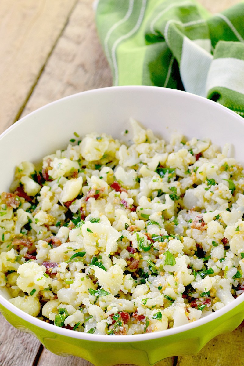 Cauliflower and Bacon Salad with Mustard Herb Vinaigrette  - This low carb and keto-friendly cauliflower salad recipe is easy to make and sure to become a favorite side for all of your barbecues, picnics, and summer parties! Light and bright, it is chock full of herbs, and with zero mayo, it is perfect for the dairy-free crowd too!