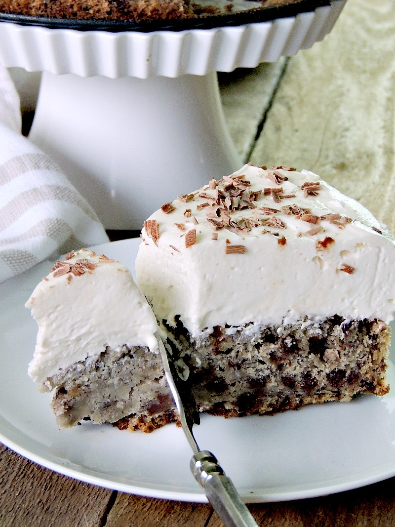 Two delicious desserts, in one place. Moist chocolate chip banana bread topped with a creamy, no-bake cheesecake from www.bobbiskozykitchen.com