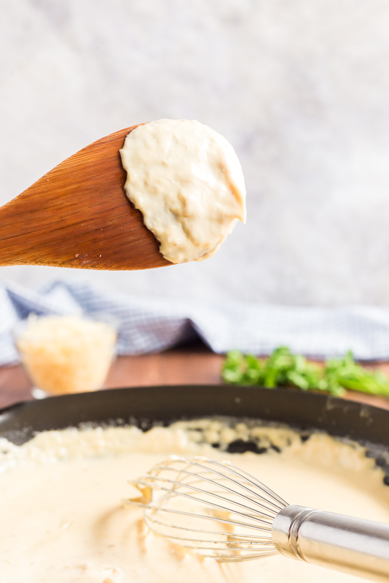 This creamy keto Alfredo Sauce is very low-carb and gluten-free. Loaded with garlic, Parmesan cheese, and just a touch of nutmeg. #glutenfree #lowcarb #keto #glutenfree #parmesan #cream #sauce #Italian #recipe #olivegarden #easy | bobbiskozykitchen.com