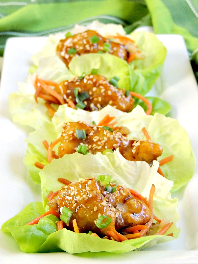 General Tso's Chicken Lettuce Wraps - Quick and easy to make, these lettuce wraps take appetizers to the next level by combining that classic Chinese entree with a favorite appetizer. The result is nothing short of delicious! #appetizer #Asian #chicken From www.bobbiskozykitchen.com
