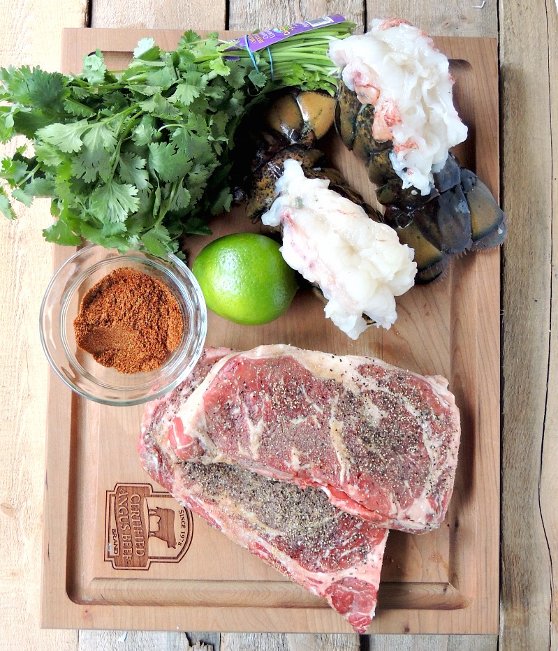 Ingredients to make Grilled Mexican Style Surf and Turf on a wooden cutting board.