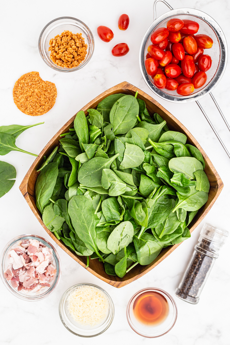 Ingredients needed to make Spinach Salad with Hot Bacon and Tomato Vinaigrette.