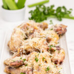 Crispy Garlic Parmesan Chicken Wings on a white serving platter.