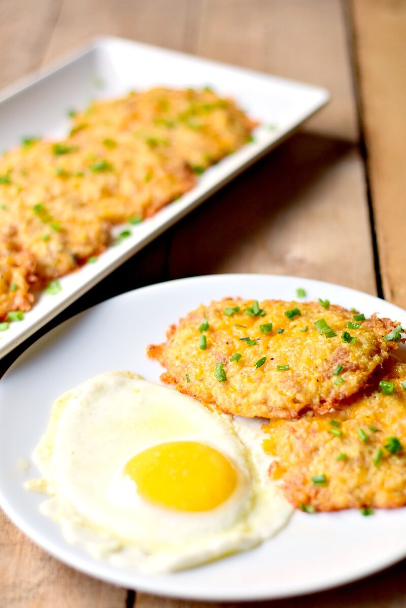 Cheesy Cauliflower Hash Browns - This low-carb cheesy cauliflower hash brown recipe is delicious, keto-friendly, gluten-free, and so easy to make!  #keto #lowcarb #glutenfree #breakfast #cauliflower #hashbrowns #easy #recipe | bobbiskozykitchen.com