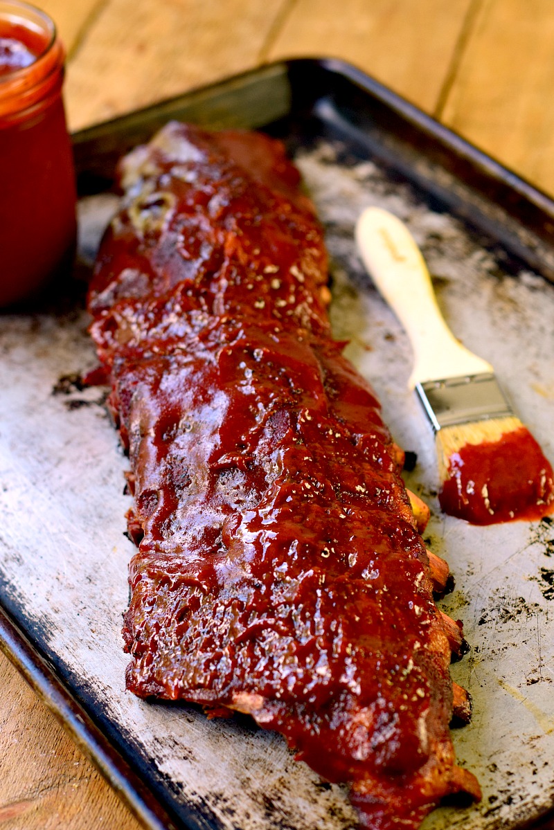 A slab of grilled ribs in Low Carb Roasted Strawberry BBQ Sauce.