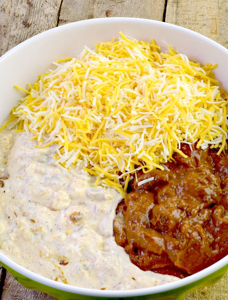Low-Carb Texas Trash Dip - The wildly popular Texas Trash Dip gets an update in this low carb version. All of the flavor, thanks to Mexican spices and chopped roasted green chiles, with a creamy, cheesy, chili mix, makes for a delicious dip for your next party or game day that is a definite crowd pleaser! #appetizer #dip #Texas #cheese #easy #recipe #lowcarb #keto | bobbiskozykitchen.com