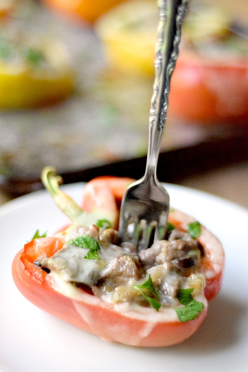 Philly Cheesesteak Stuffed Pepper on a white place with a silver fork.