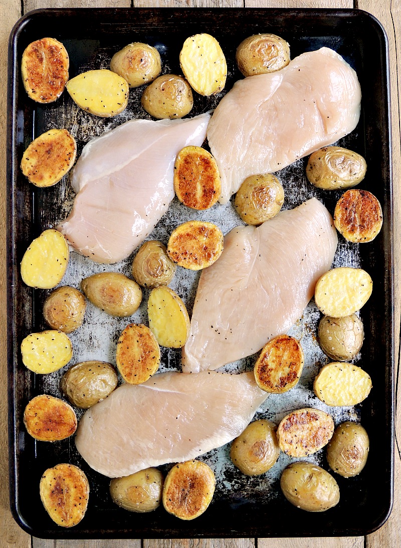 Chicken and potatoes on a sheet pan.