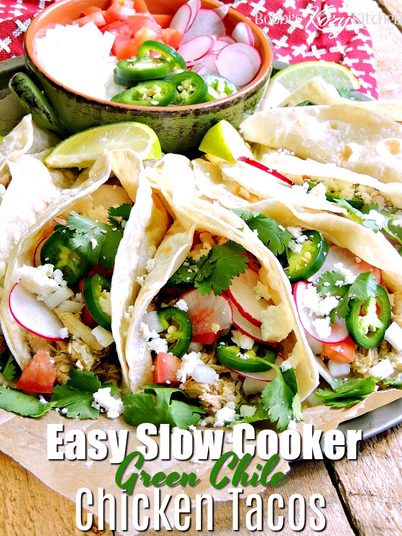 This Creamy Slow Cooker Green Chile Chicken Taco recipe is easy to make and perfect for those busy nights you don't have time to cook for the family. BONUS it is low carb/keto-friendly! #slowcooker #crockpot #lowcarb #keto #greenchile #chicken #tacos #easy #recipe | bobbiskozykitchen.com
