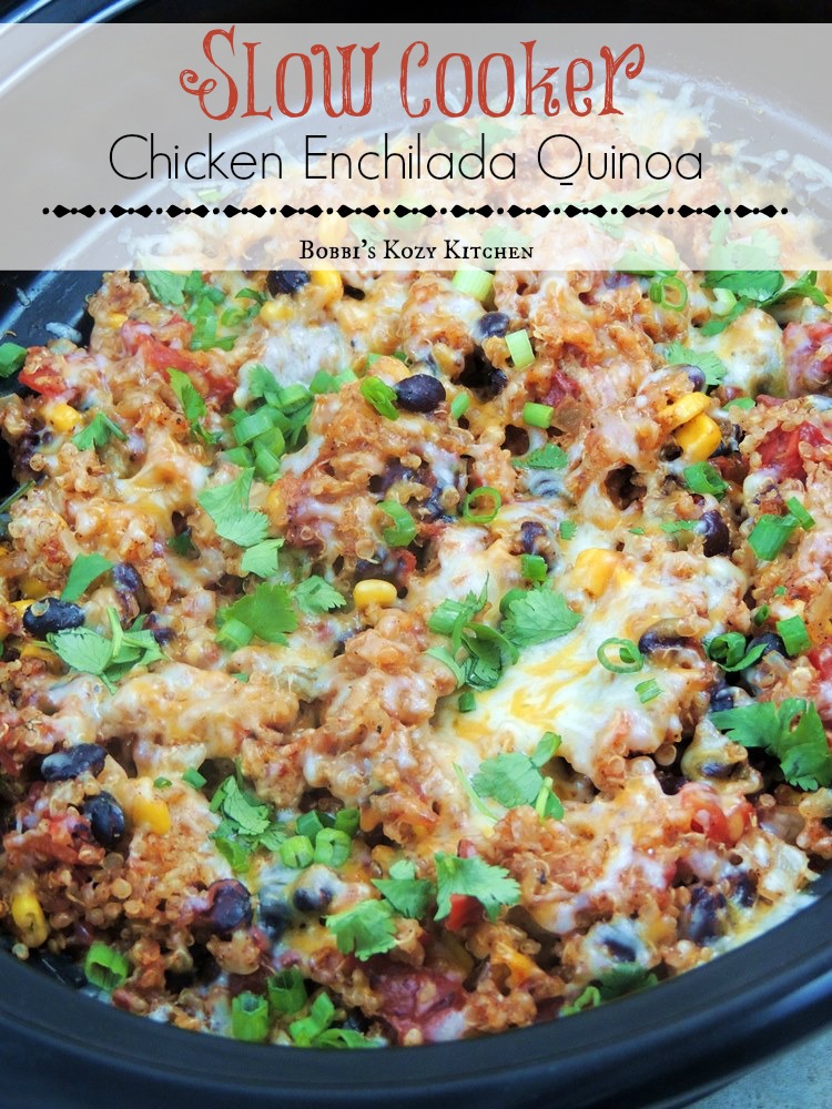 Overhead view of Slow Cooker Chicken Enchilada Quinoa in the crockpot sprinkled with fresh chopped green onions and cilantro.