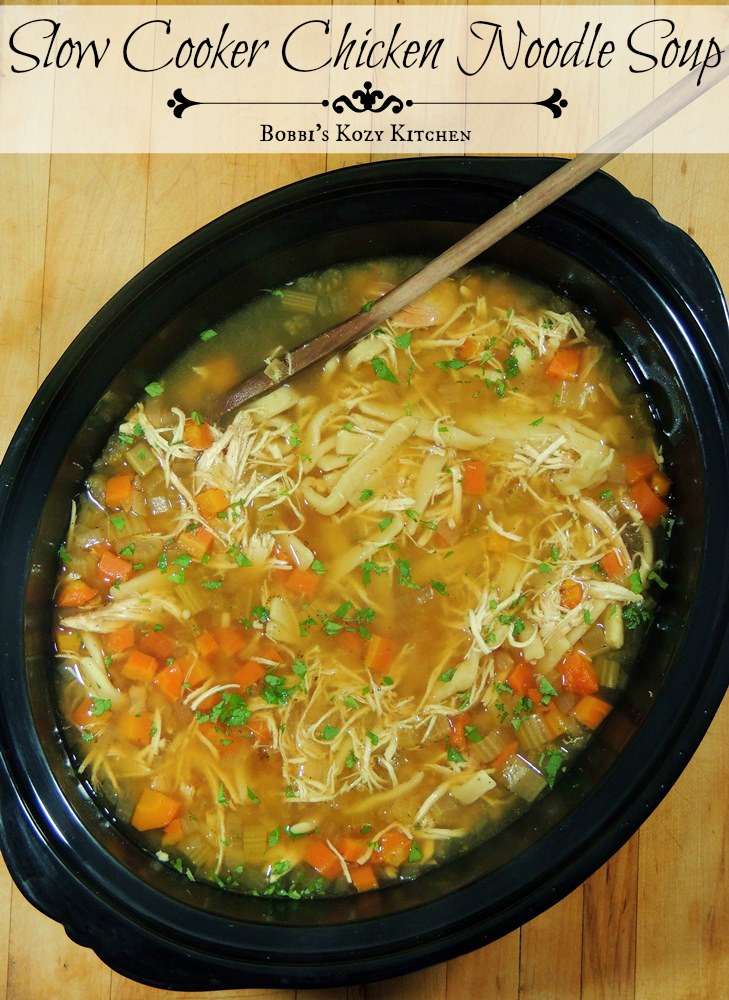 Slow Cooker Chicken Noodle Soup - Break out that slow cooker and make this soup ASAP!! It is, hands down, the best chicken noodle soup ever! From www.bobbiskozykitchen.com