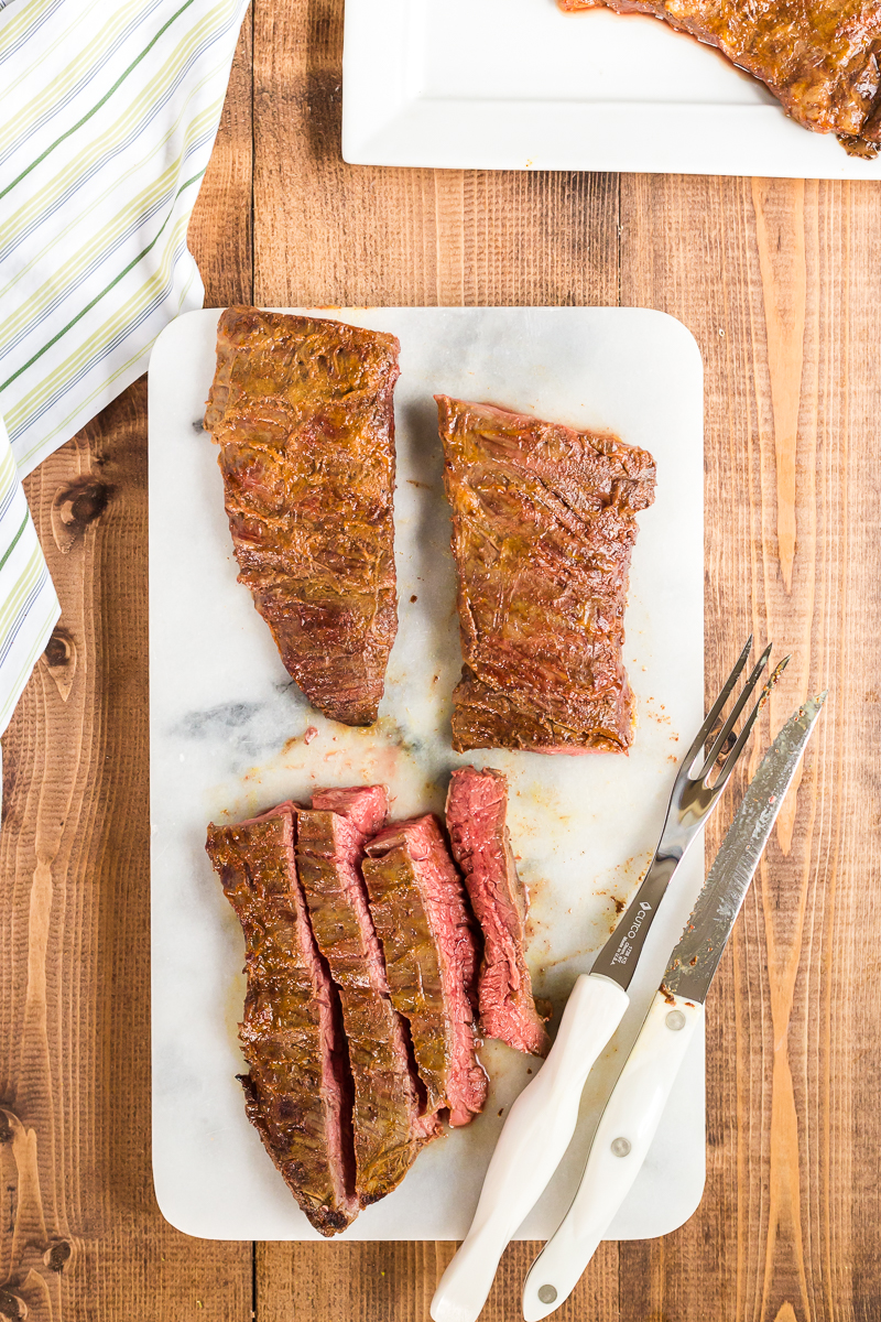 This Grilled Tandoori Steak is an easy to prepare low carb dish the whole family will love. Skirt (or flank) steak in an Indian inspired tandoori marinade and grilled to perfection. #lowcarb #keto #beef #steak #Grilled #tandoori #indian #easy #recipe | bobbiskozykitchen.com