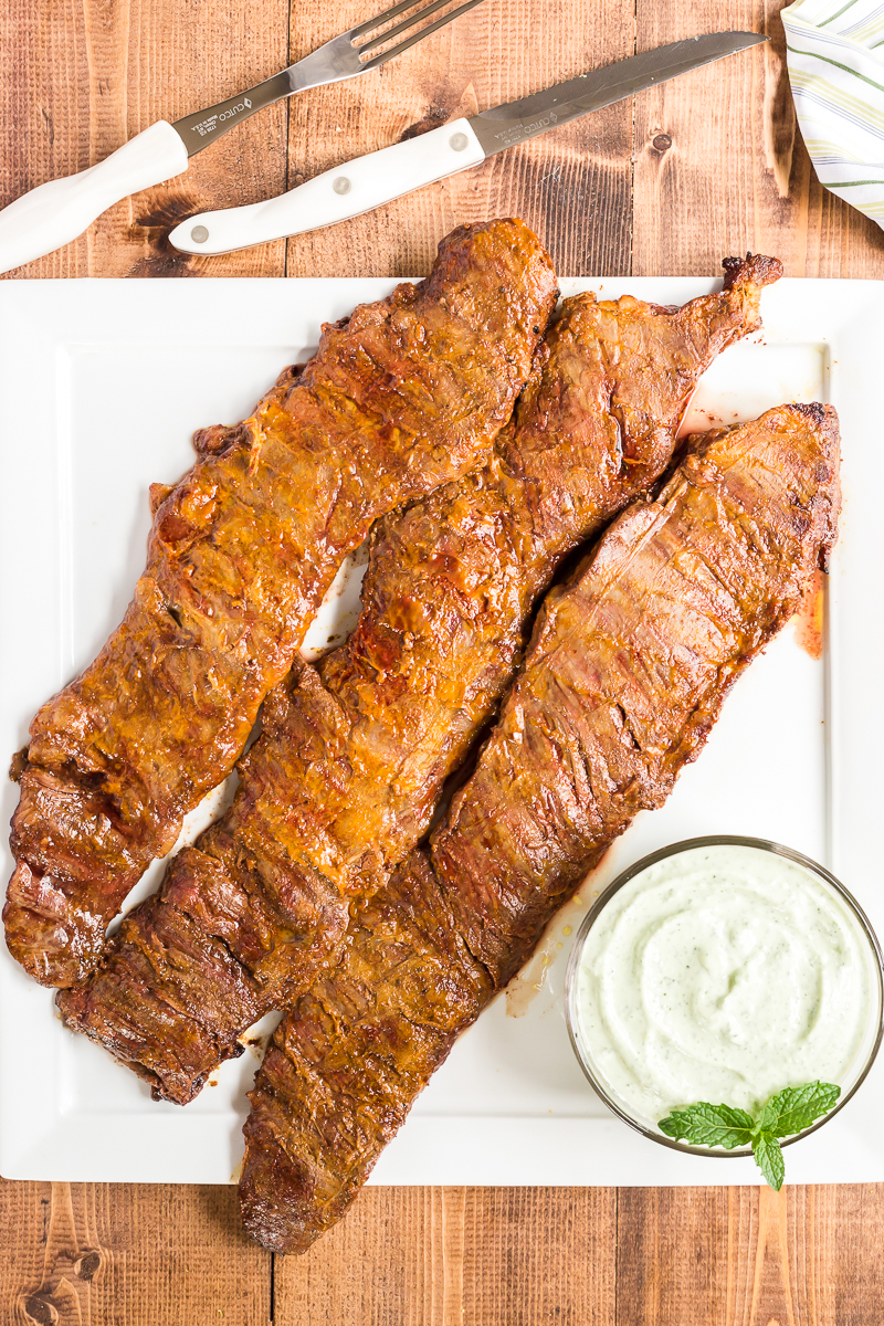 This Grilled Tandoori Steak is an easy to prepare low carb dish the whole family will love. Skirt (or flank) steak in an Indian inspired tandoori marinade and grilled to perfection. #lowcarb #keto #beef #steak #Grilled #tandoori #indian #easy #recipe | bobbiskozykitchen.com