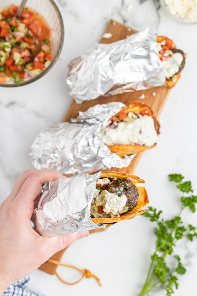 Overhead photo of three Low Carb Gyros wrapped in foil.