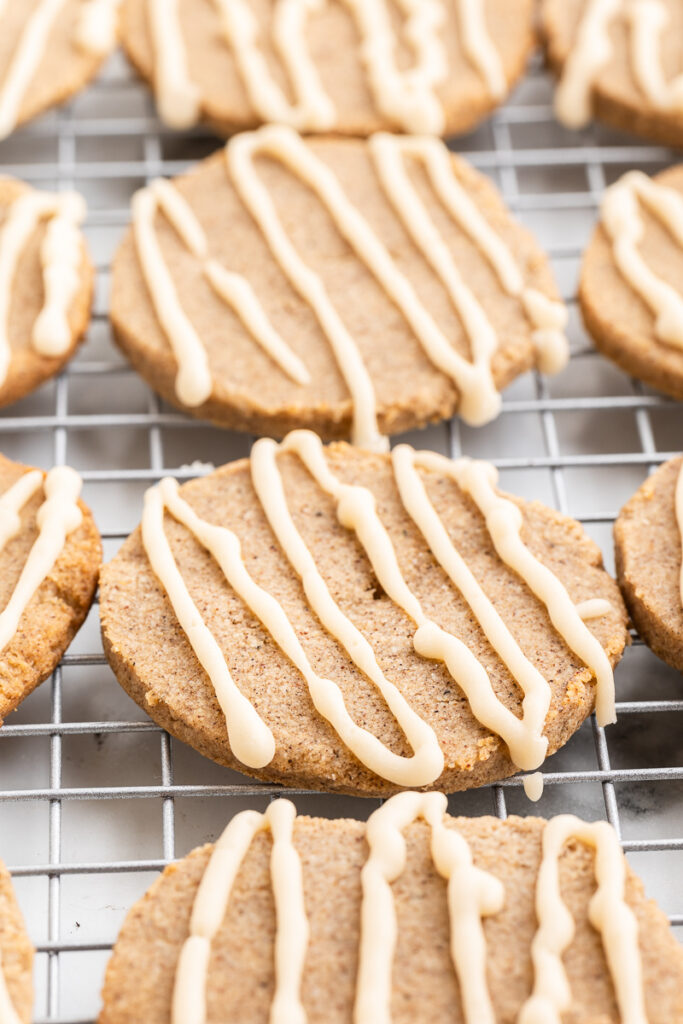 Keto Chai Sugar Cookies with Espresso Glaze on a metal cooling rack.