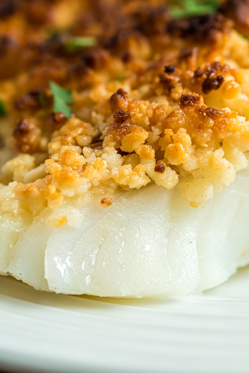 Closeup of an oven baked coconut macadamia fish fillet.