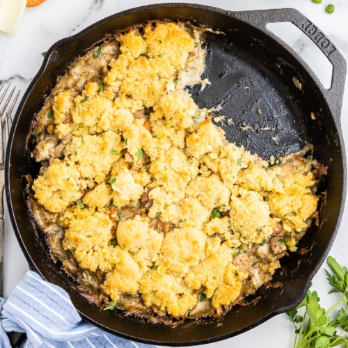 Keto chicken and biscuit casserole in a cast iron skillet.