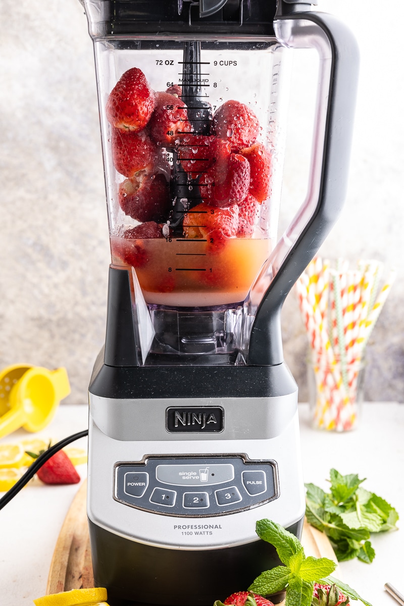 Fresh strawberries and lemon juice with keto sweetener and water in a high speed blender.