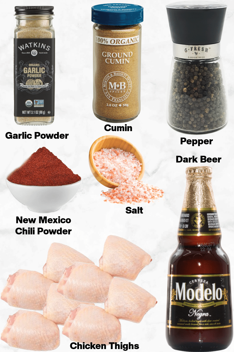 The ingredients needed to make Keto Mexican Beer Braised Chicken Thighs on a white marble background.