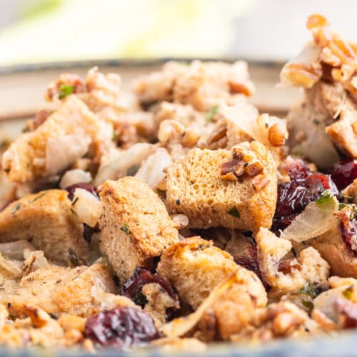 Close up of keto cranberry pecan stuffing in a casserole dish.