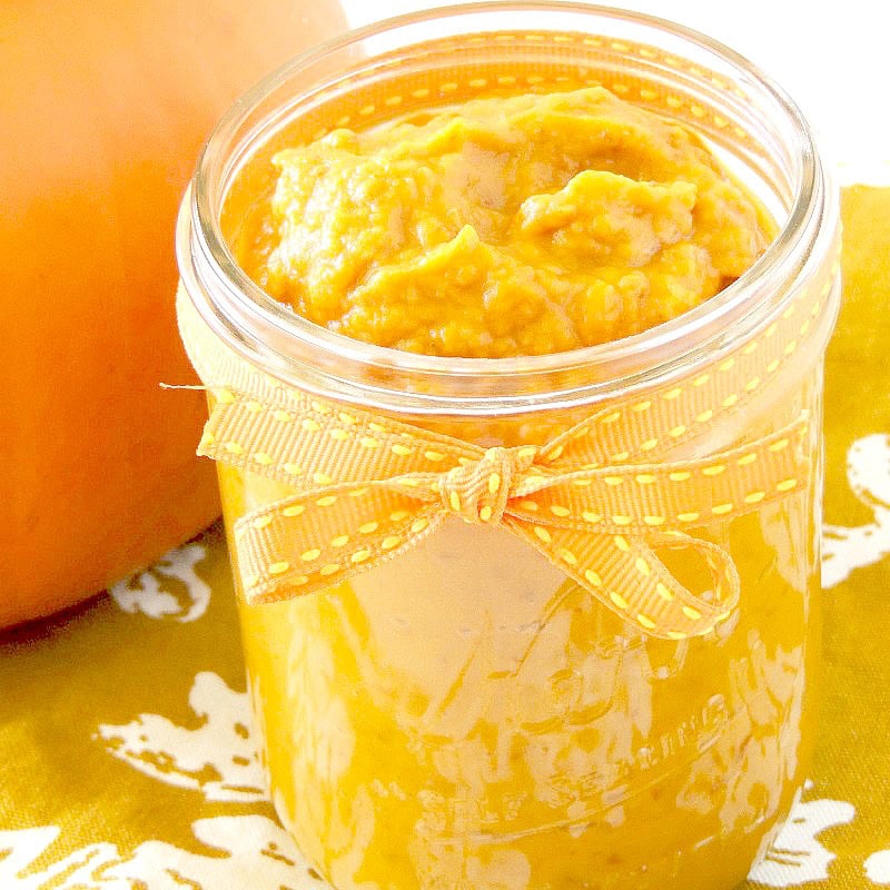 Close up of homemade pumpkin puree in a small mason jar in the sunlight. Homemade Pumpkin Puree: Instant Pot & Slow Cooker! 