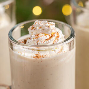 Closeup of a glass mug full of keto eggnog.