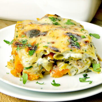Closeup of a low-carb turkey lasagna made with roasted butternut squash and brussels sprouts on a white plate.