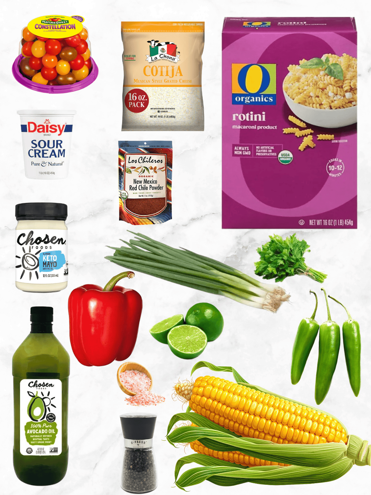All of the ingredients needed to make ELote Pasta Salad on a white marble background.
