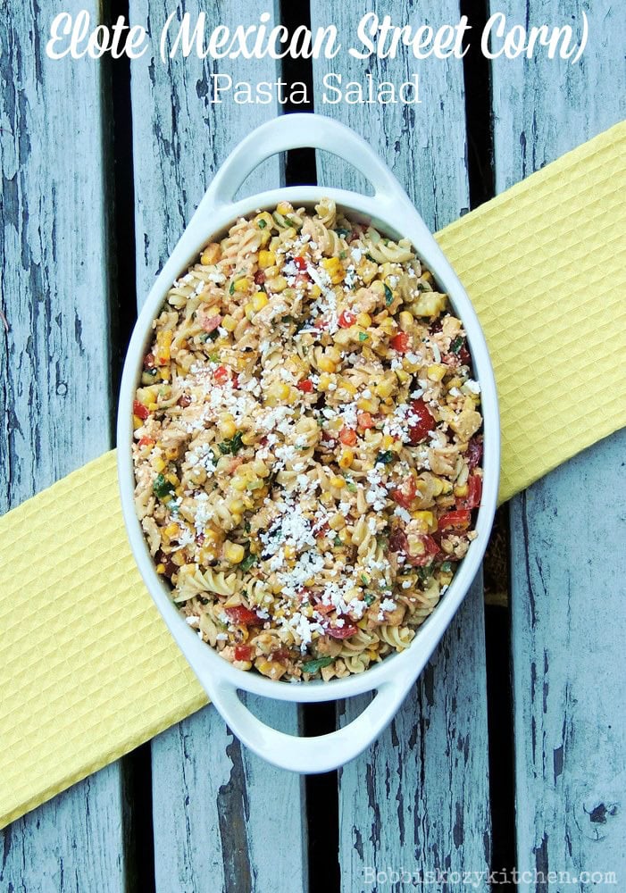Overhead view of a white oval serving dish full of Elote (Mexican Street Corn) Pasta Salad.