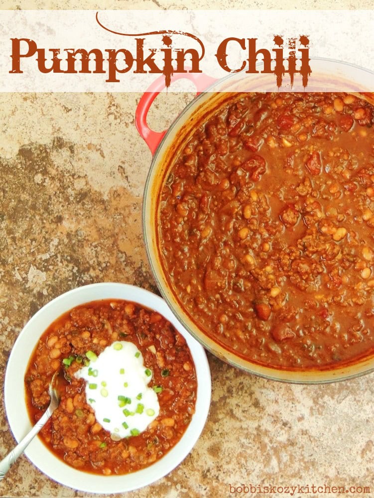 Overhead view of pumpkin chili in a pot and in a white bowl.